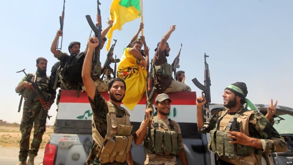 متطوعون من الحشد الشعبي يحتفلون بهد تطهير مناطقهم من دنس داعش