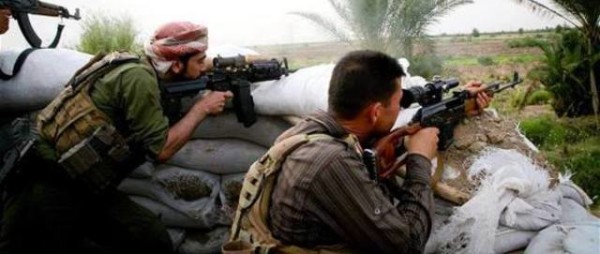 مقاتلون من الحشد الشعبي يصدون هجوم لداعش في مدينة بلد