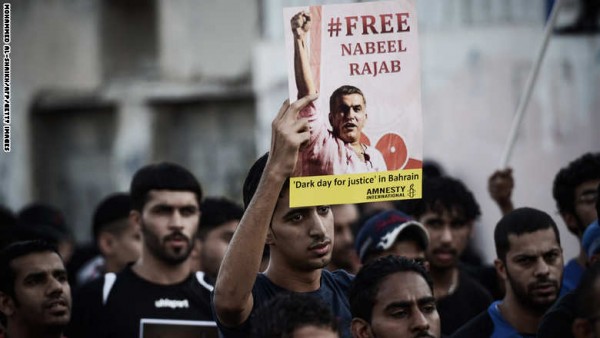 A Bahraini protester shows a poster asking for the release of jailed human right activist Nabeel Rajab during an anti-regime protest in the village of al-Malkiyah, South of Manama, on August 27, 2013. National dialogue launched in February will resume on August 28, 2013 after a summer break, aimed at resolving Bahrain's political deadlock since its 2011 Shiite-led revolt.   AFP PHOTO/MOHAMMED AL-SHAIKH        (Photo credit should read MOHAMMED AL-SHAIKH/AFP/Getty Images)