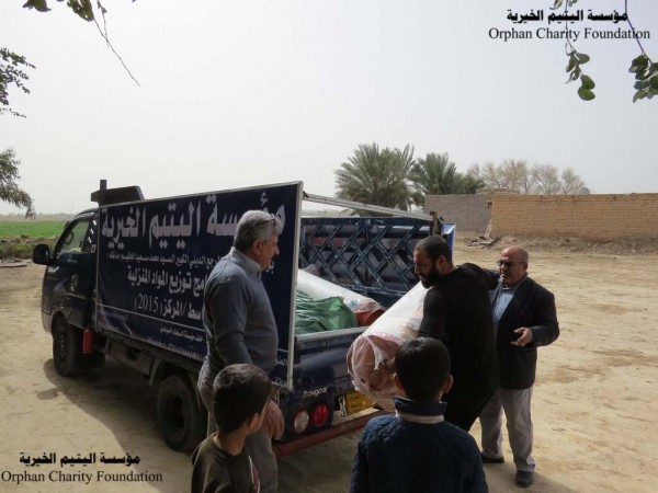 توزيع المساعدات العينية على عاوئل شهداء محافظة واسط من قبل مؤسسة اليتميم الخيرية