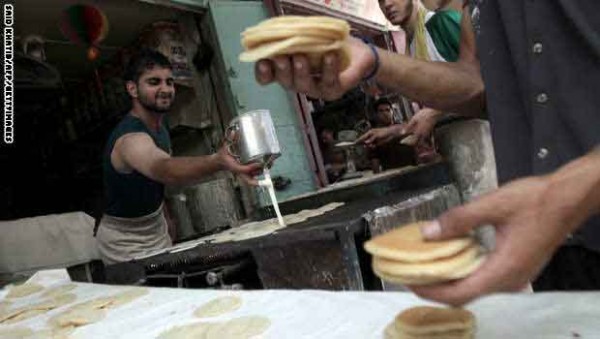 A Palestinian baker prepares "Qatayef",