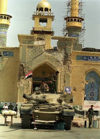 The Iraqi military secures a damaged mosque in the holy city of Karbala, in March 1991, after Shiite Moslems led an unsuccessful rebellion against Saddam Husseins forces. (Photo Norbert Schiller)