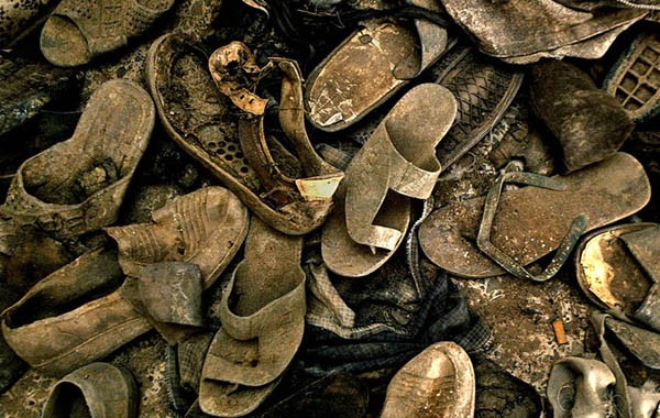 The tattered shoes of the dead, recovered from mass graves in the area of Mussaib, form a grim pile of evidence.