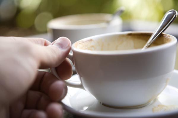 Hand Holding Coffee Cup