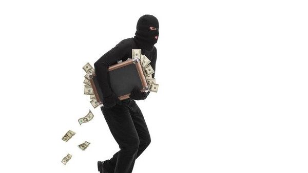 Burglar running with a bag full of money