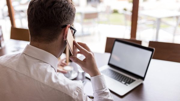 businessman using smartphone and laptop